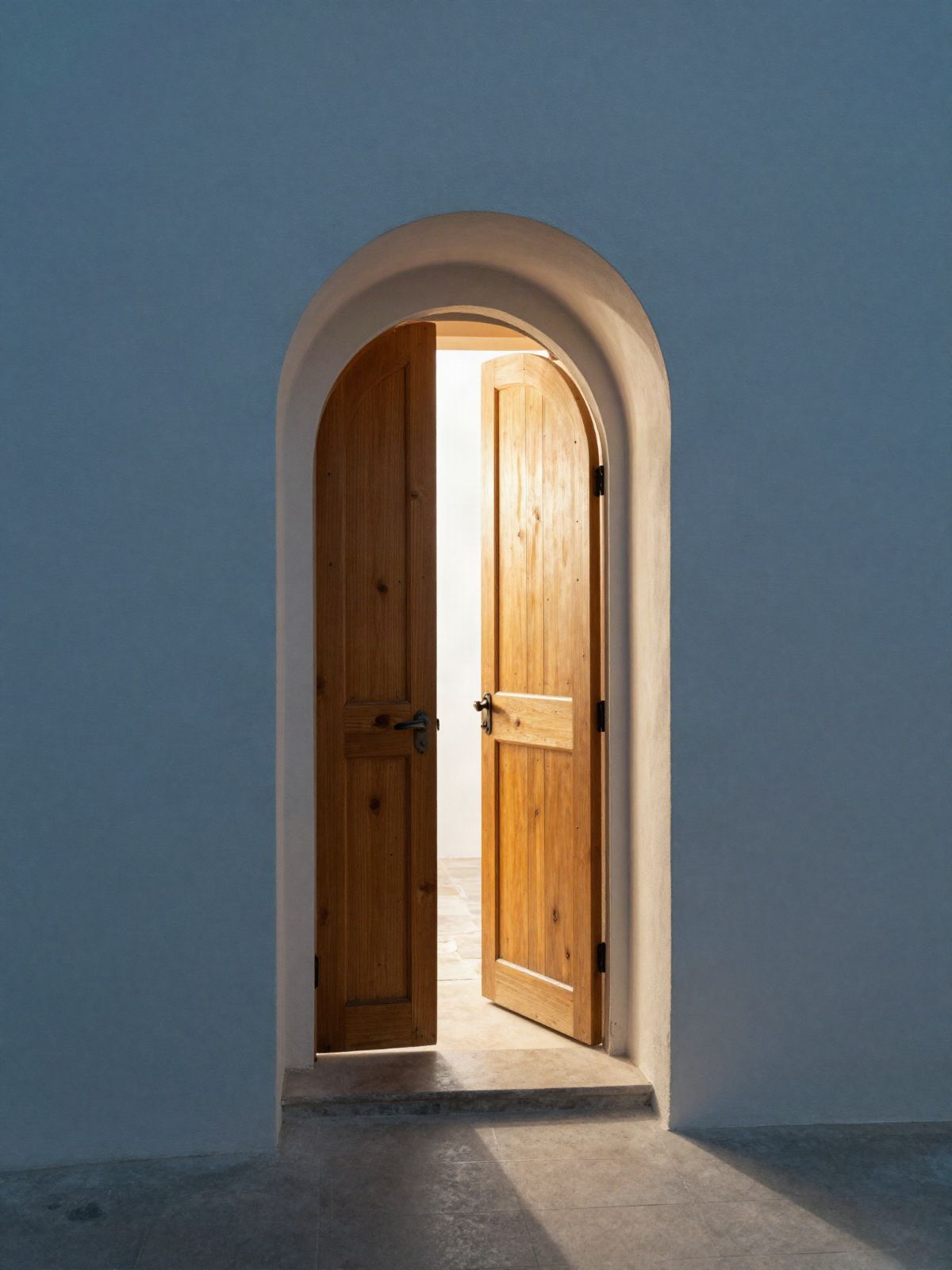 Illustrative image: light pouring through an open arched doorway